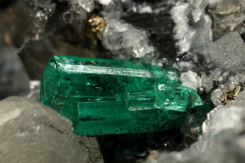 Beryl (variety emerald), Calcite, Pyrite<br />La Pita mining district, Municipio Maripí, Western Emerald Belt, Boyacá Department, Colombia<br />54x36x60mm, xl=8mm<br /> (Author: Fiebre Verde)