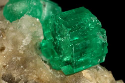 Beryl (variety emerald), Calcite<br />Muzo mining district, Western Emerald Belt, Boyacá Department, Colombia<br />60x47x49mm, central xl=16mm<br /> (Author: Fiebre Verde)