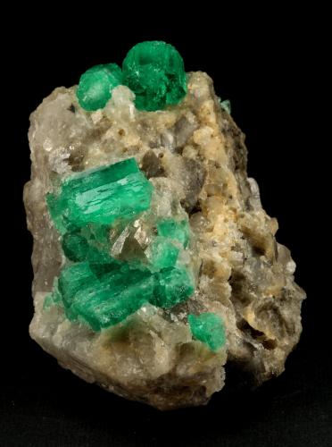 Beryl (variety emerald), Calcite<br />Muzo mining district, Western Emerald Belt, Boyacá Department, Colombia<br />60x47x49mm, central xl=16mm<br /> (Author: Fiebre Verde)