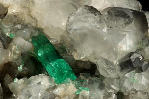 Beryl (variety emerald), Calcite<br />La Pita mining district, Polveros Mine, Municipio Maripí, Western Emerald Belt, Boyacá Department, Colombia<br />110x85x85mm, xl=30mm<br /> (Author: Fiebre Verde)