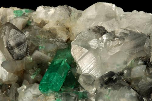 Beryl (variety emerald), Calcite<br />La Pita mining district, Polveros Mine, Municipio Maripí, Western Emerald Belt, Boyacá Department, Colombia<br />110x85x85mm, xl=30mm<br /> (Author: Fiebre Verde)