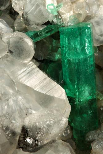 Beryl (variety emerald), Calcite<br />La Pita mining district, Polveros Mine, Municipio Maripí, Western Emerald Belt, Boyacá Department, Colombia<br />110x85x85mm, xl=30mm<br /> (Author: Fiebre Verde)