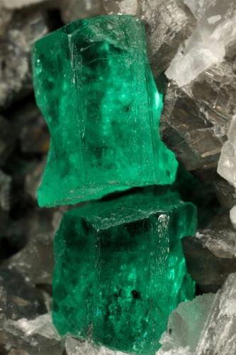 Beryl (variety emerald), Calcite<br />La Pita mining district, Municipio Maripí, Western Emerald Belt, Boyacá Department, Colombia<br />60x55x80mm, xl=6+8mm<br /> (Author: Fiebre Verde)