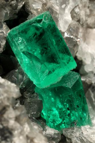 Beryl (variety emerald), Calcite<br />La Pita mining district, Municipio Maripí, Western Emerald Belt, Boyacá Department, Colombia<br />60x55x80mm, xl=6+8mm<br /> (Author: Fiebre Verde)