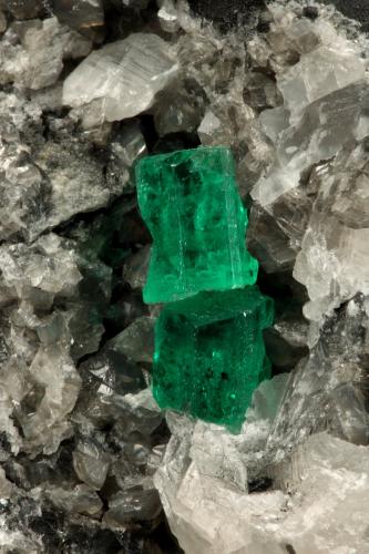 Beryl (variety emerald), Calcite<br />La Pita mining district, Municipio Maripí, Western Emerald Belt, Boyacá Department, Colombia<br />60x55x80mm, xl=6+8mm<br /> (Author: Fiebre Verde)