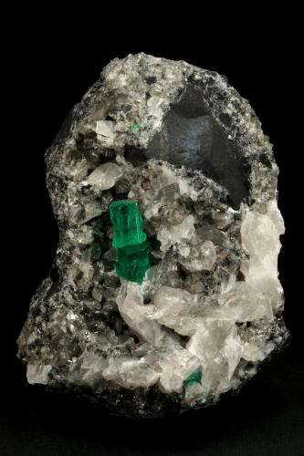 Beryl (variety emerald), Calcite<br />La Pita mining district, Municipio Maripí, Western Emerald Belt, Boyacá Department, Colombia<br />60x55x80mm, xl=6+8mm<br /> (Author: Fiebre Verde)