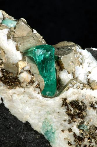 Beryl (variety emerald), Calcite, Pyrite<br />Chivor mining district, Municipio Chivor, Eastern Emerald Belt, Boyacá Department, Colombia<br />102x36x87mm, xl=13mm<br /> (Author: Fiebre Verde)