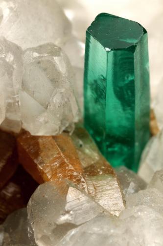 Beryl (variety emerald), Calcite, Parisite<br />La Pita mining district, Municipio Maripí, Western Emerald Belt, Boyacá Department, Colombia<br />8x8x8cm, H35mm, xl=8mm<br /> (Author: Fiebre Verde)