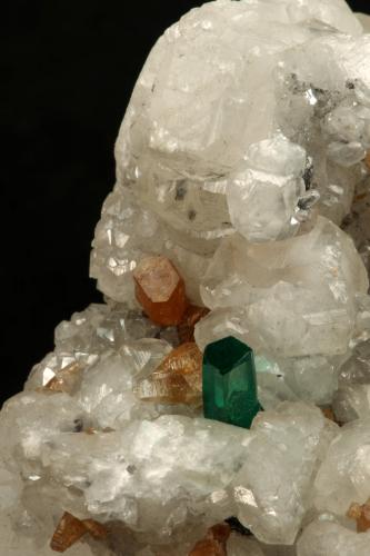 Beryl (variety emerald), Calcite, Parisite<br />La Pita mining district, Municipio Maripí, Western Emerald Belt, Boyacá Department, Colombia<br />8x8x8cm, H35mm, xl=8mm<br /> (Author: Fiebre Verde)