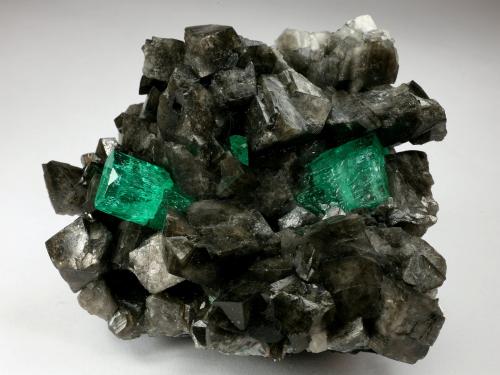 Beryl (variety emerald), Calcite<br />Coscuez mining district, Municipio San Pablo de Borbur, Western Emerald Belt, Boyacá Department, Colombia<br />68x62x40mm, xl=15mm<br /> (Author: Fiebre Verde)