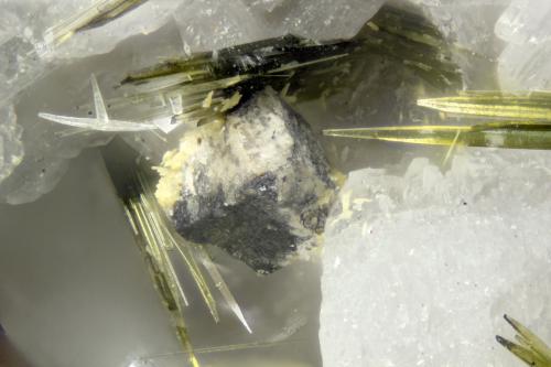 Cerussite  Wulfenite  Galena  Aegirine<br />Poudrette Quarry, Mont Saint-Hilaire, La Vallée-du-Richelieu RCM, Montérégie, Québec, Canada<br />FOV = 2mm<br /> (Author: Doug)