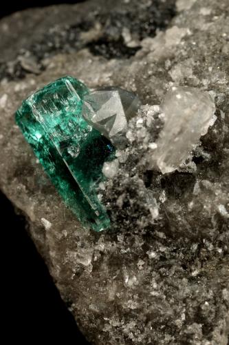 Beryl (variety emerald), Calcite, Dolomite<br />Muzo mining district, Western Emerald Belt, Boyacá Department, Colombia<br />triangle side=35mm, xl=11mm<br /> (Author: Fiebre Verde)