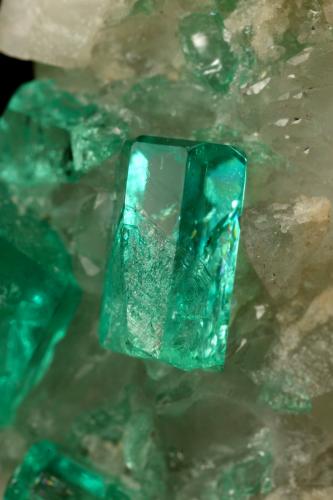 Beryl (variety emerald), Calcite, Dolomite<br />La Pita mining district, Cunas Mine, Municipio Maripí, Western Emerald Belt, Boyacá Department, Colombia<br />42x39x34mm, xls up to 7mm<br /> (Author: Fiebre Verde)