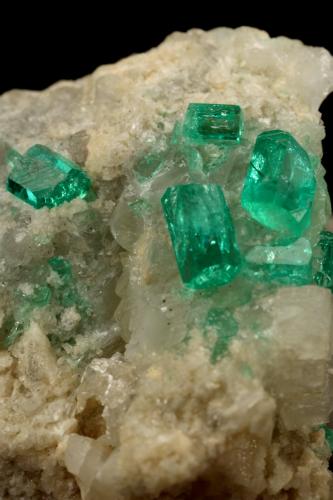 Beryl (variety emerald), Calcite, Dolomite<br />La Pita mining district, Cunas Mine, Municipio Maripí, Western Emerald Belt, Boyacá Department, Colombia<br />42x39x34mm, xls up to 7mm<br /> (Author: Fiebre Verde)