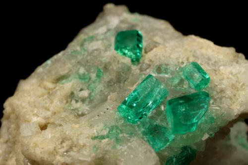 Beryl (variety emerald), Calcite, Dolomite<br />La Pita mining district, Cunas Mine, Municipio Maripí, Western Emerald Belt, Boyacá Department, Colombia<br />42x39x34mm, xls up to 7mm<br /> (Author: Fiebre Verde)