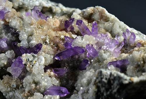 Quartz (var. amethyst), Calcite<br />Capurru Quarry, Osilo, Sassari Province, Sardinia/Sardegna, Italy<br />Fov 4.5 cm.<br /> (Author: Martin Rich)