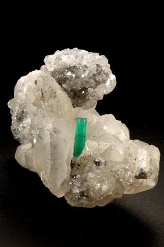 Beryl (variety emerald), Calcite<br />La Pita mining district, Polveros Mine, Municipio Maripí, Western Emerald Belt, Boyacá Department, Colombia<br />35x64x49mm, xl=12mm<br /> (Author: Fiebre Verde)