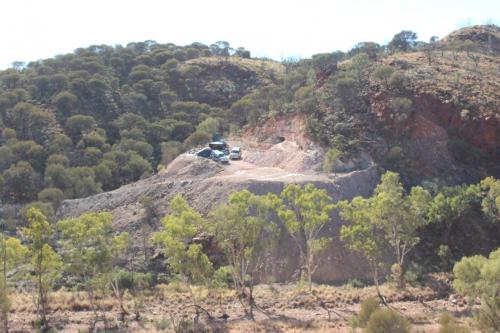 Photo 1. Mine site and tent camp looking to the north west.  The NT Government environmental assessor required that we change our monitoring site so they could gain a better perspective of our waste rock placement over the footprint of the much larger area of historic quarrying and underground waste.  No, we are not dumping our waste rock in the creek! (Author: crocoite)