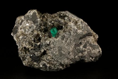 Beryl (variety emerald), Calcite, Pyrite<br />Muzo (distrito minero), Cinturón Esmeraldífero Occidental, Departamento Boyacá, Colombia<br />76x47x45mm, xl=7x5mm<br /> (Author: Fiebre Verde)