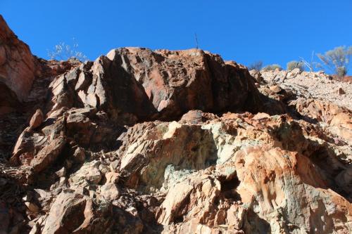 Photo 7. Sandstone rotated from near horizontal to vertical in a crush zone rich in copper oxides. (Author: crocoite)