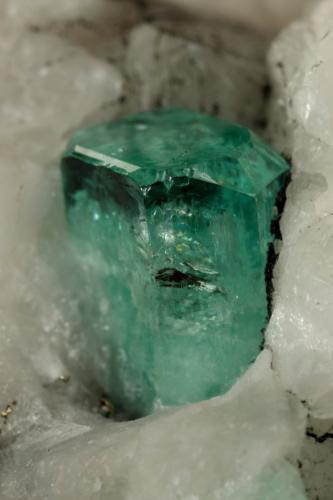 Beryl (variety emerald), Calcite, Pyrite<br />Muzo mining district, Western Emerald Belt, Boyacá Department, Colombia<br />65x49x45mm, xl=8x6mm<br /> (Author: Fiebre Verde)