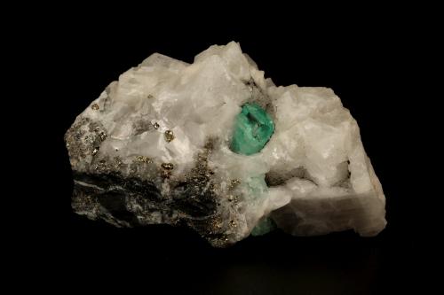 Beryl (variety emerald), Calcite, Pyrite<br />Muzo mining district, Western Emerald Belt, Boyacá Department, Colombia<br />65x49x45mm, xl=8x6mm<br /> (Author: Fiebre Verde)