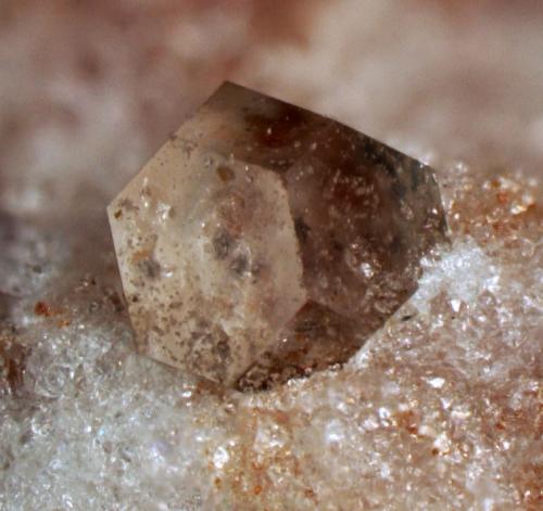 Zunyite<br />Big Bertha Mine (Veta Grande Mine), Middle Camp-Oro Fino District, Dome Rock Mountains, La Paz County, Arizona, USA<br />0.8 mm crystal<br /> (Author: Pete Richards)