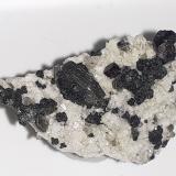 Cafarsite, Quartz, Muscovite,  Clinochlore (variety ripidolite)<br />Wannigletscher, Scherbadung (Monte Cervandone), Kriegalp Valley, Binn Valley (Binntal), Wallis (Valais), Switzerland<br />2,5 x 1,5 cm<br /> (Author: Volkmar Stingl)