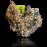 Meta-autunite on 'lepidolite' with Cookeite and Tourmaline (Group)<br />Golconda pegmatite, Governador Valadares, Vale do Rio Doce, Minas Gerais, Brazil<br />7 x 4 x 6.5 cm / main crystal: 2.2 cm<br /> (Author: MIM Museum)