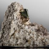 Bertrandite with Chlorite inclusions and Quartz (variety smoky)Zona del túnel de base Furka, Realp, Urseren, Uri, Suiza8 x 3 x 6 cm / main crystal: 1.7 cm (Author: MIM Museum)