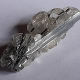 Stibnite, Calcite<br />Xikuangshan Sb deposit, Lengshuijiang, Loudi Prefecture, Hunan Province, China<br />4 x 1,5 cm<br /> (Author: Volkmar Stingl)