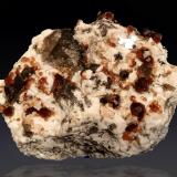 Spessartine, Quartz (variety smoky) and MicroclineCatas Spessartina Wushan, Tongbei, Yunxiao, Prefectura Zhangzhou, Provincia Fujian, China58 mm x 52 mm x 30 mm (Author: Firmo Espinar)