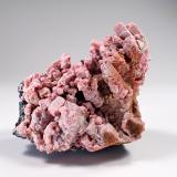 Rhodonite, Franklinite<br />Franklin Mine, Franklin, Franklin Mining District, Sussex County, New Jersey, USA<br />56 mm x 42 mm x 46 mm<br /> (Author: Don Lum)