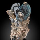 Hematite<br />Cavradi, Curnera Valley, Tujetsch (Tavetsch), Vorderrhein Valley, Grischun (Grisons; Graubünden), Switzerland<br />7 x 6.5 x 12 cm / main crystal: 5.2 cm.<br /> (Author: MIM Museum)