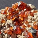 Spessartine (Garnet Group), MicroclineWushan Spessartine prospects, Tongbei, Yunxiao, Zhangzhou Prefecture, Fujian Province, China6,5 x 3,5 cm (Author: Volkmar Stingl)