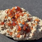 Spessartine (Garnet Group), MicroclineWushan Spessartine prospects, Tongbei, Yunxiao, Zhangzhou Prefecture, Fujian Province, China6,5 x 3,5 cm (Author: Volkmar Stingl)