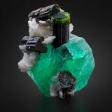 Fluorite with Tourmaline (Group) and Albite (variety cleavelandite)<br />Stak Nala, Haramosh Mountains, Skardu District, Gilgit-Baltistan (Northern Areas), Pakistan<br />6.5 x 6.5 x 8 cm / main crystal: 6.1 cm.<br /> (Author: MIM Museum)