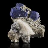 Lazurite with Calcite<br />Sar-e Sang, Koksha Valley, Khash & Kuran Wa Munjan Districts, Badakhshan Province, Afghanistan<br />8 x 10 x 7.5 cm / main crystal: 4.1 cm<br /> (Author: MIM Museum)