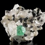 Fluorite with Quartz, Tourmaline (Group) and Mica (Group)<br />Stak Nala, Haramosh Mountains, Skardu District, Gilgit-Baltistan (Northern Areas), Pakistan<br />23 x 23 x 8 cm / main crystal: 5 cm<br /> (Author: MIM Museum)