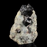 Hercynite<br />Kaluganga Valley, Ratnapura, Ratnapura District, Sabaragamuwa Province, Sri Lanka<br />8 x 3 x 10 cm / main crystal: 3.6 cm.<br /> (Author: MIM Museum)