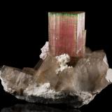 Elbaite with Quartz (variety smoky) and 'lepidolite'<br />Paprok, Kamdesh District, Nuristan Province, Afghanistan<br />19 x 14 x 14.5 cm / main crystal: 9.2 cm.<br /> (Author: MIM Museum)