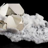 Pyrite with Calcite and Graphite<br />Merelani Hills, Lelatema Mountains, Simanjiro District, Manyara Region, Tanzania<br />13 x 8.5 x 5.5 cm / main crystal: 5.5 cm.<br /> (Author: MIM Museum)