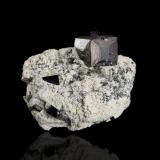 Magnetite on Halite<br />Balmat, Balmat-Edwards Zinc District, St. Lawrence County, New York, USA<br />7 x 5 x 5.5 cm / main crystal: 2.8 cm.<br /> (Author: MIM Museum)