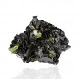 Graphite with Diopside and Mesolite<br />Karo Pit, D-Block Mine, Merelani Hills, Lelatema Mountains, Simanjiro District, Manyara Region, Tanzania<br />4.5 x 3.5 x 1.5 cm / main crystal: 1.1 cm<br /> (Author: MIM Museum)