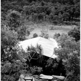 El Sherana Processing Plant

Photo showing part of the derelict remains of the El Sherana mine’s Gravity Separation Plant. The plant was constructed in 1956 to process the rich Uranium ore extracted from the nearby mines. Gimbat Road is in the background. (Photo courtesy of S. Kerber) (Author: silvia)