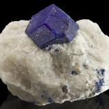 Lazurite<br />Sar-e Sang, Koksha Valley, Khash & Kuran Wa Munjan Districts, Badakhshan Province, Afghanistan<br />9 x 7 x 6 cm / main crystal: 3.7 cm.<br /> (Author: MIM Museum)