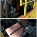 COPPER CATHODE PROCESSING

The journey of Copper from electrolyte to a marketable product culminates in the crucial post-electrowinning phase at the Copper cathode plant. Once the electrowinning cycle was complete, the cells yielded crude Copper cathodes – substantial Copper sheets adhering to reusable stainless steel blanks. The initial, highly mechanized step involved the precise removal of these Copper sheets. Automated stripping machines were employed, designed to efficiently peel the deposited Copper from the inert cathode blanks without damaging either the valuable Copper or the blanks, which were immediately returned to the electrolytic cells for reuse. 

After separation, these raw Copper sheets, often referred to as full plates, underwent further refinement. They were then conveyed to a trimming station where hydraulic shears or guillotines cut them to precise, standardized dimensions. This sizing ensured uniformity for subsequent handling, packaging, and adherence to customer specifications. While the electrowinning process itself yielded high-purity Copper, a final surface preparation, usually a thorough rinse with demineralized water, was performed to remove any residual electrolyte, dust, or minor surface impurities. This step ensured the pristine quality and appearance of the final product.

Finally, the prepared Copper cathodes were systematically stacked. They were typically stacked horizontally, often on pallets, in precise numbers – commonly 20 to 50 sheets per stack, depending on the cathode thickness and desired bundle weight. These stacks were then bound with steel strapping, ready for weighing, quality inspection, and dispatch to various industries worldwide.

To transform these cathodes into various Copper products, they were subjected to further processing at facilities exterior to the mine. This usually involved melting the cathodes in a shaft furnace, followed by continuous casting and rolling. The molten Copper was cast into a suitable form, often a thick slab or strip, which was then passed through a series of rolling mills. This mechanical working reduced the thickness of the Copper, enhances its grain structure, and improved its mechanical properties; ultimately producing high-quality Copper sheets of the desired gauge and finish, maintaining the exceptional 99.99% purity.

Original photos courtesy of Salvador Rivera (Author: silvia)