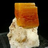 Wulfenite on CalciteMina Erupción (Mina Ahumada), Sierra de Los Lamentos, Municipio Ahumada, Chihuahua, México2.6 × 2.8 × 3 cm (Author: Jordi Fabre)