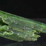 Tremolite (Cr-bearing variety) with Clinohumite and Graphite<br />Washburn Farm, Macomb, Macomb Township, St. Lawrence County, New York, USA<br />3.6 × 1.5 × 1.5 cm<br /> (Author: Jordi Fabre)