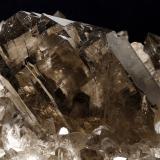 Quartz (varieties smoky and gwindel) with Albite<br />Grimsel area, Hasli Valley, Bern, Switzerland<br />main crystal size: 9.7 × 6 cm<br /> (Author: Jordi Fabre)